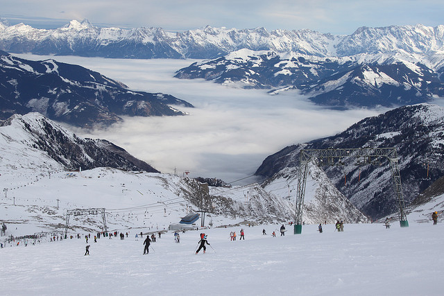 Image of skiers in the Alps on a snowy day
