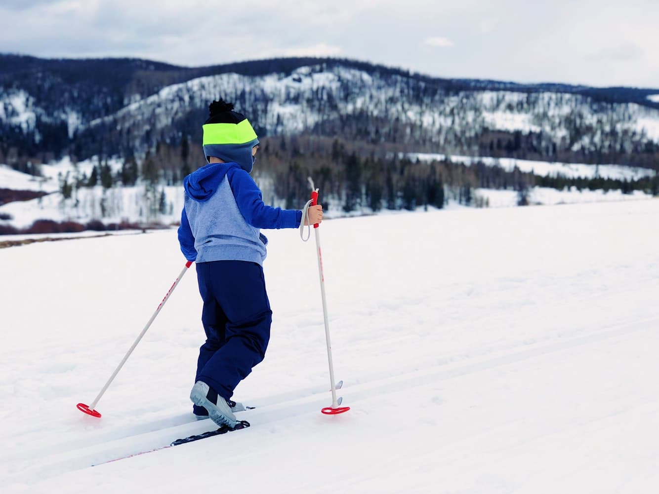 Young child using ski equipment