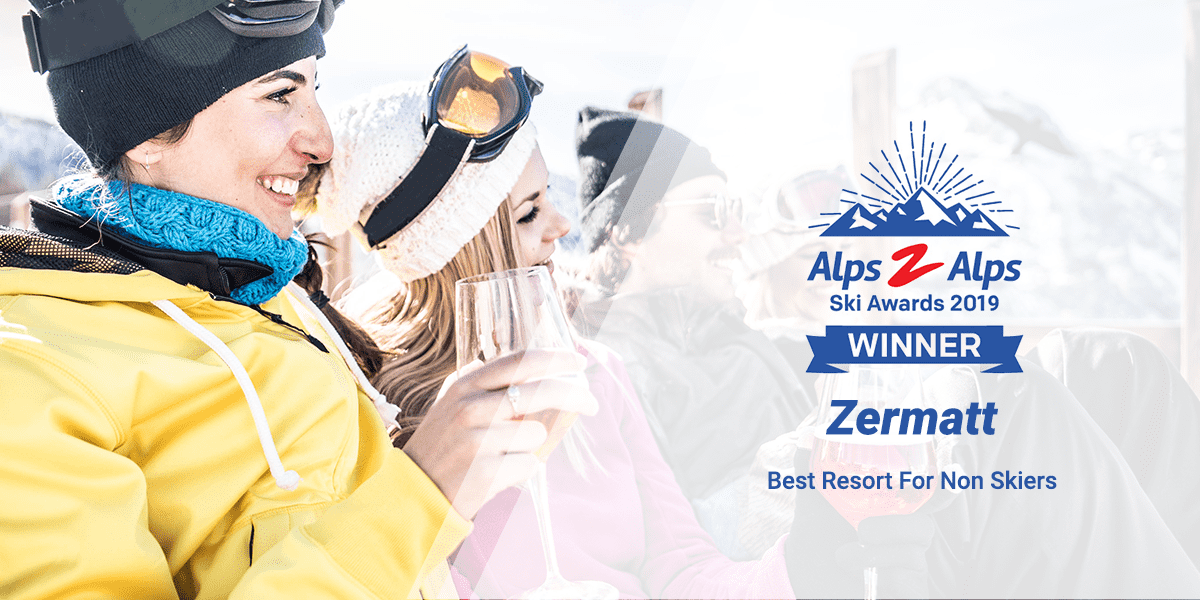 People drinking in the alps with text