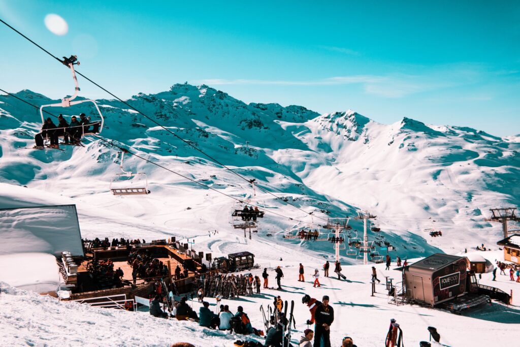 Busy mountain in French ski resort with ski lift